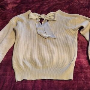 Chic Cream V-Neck Sweater with Bow Accent